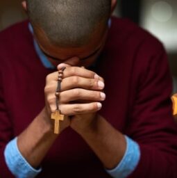 Hell answer all your prayers. Cropped shot of a man holding a rosary and praying.